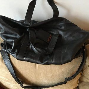 TUMI black leather duffle bag
